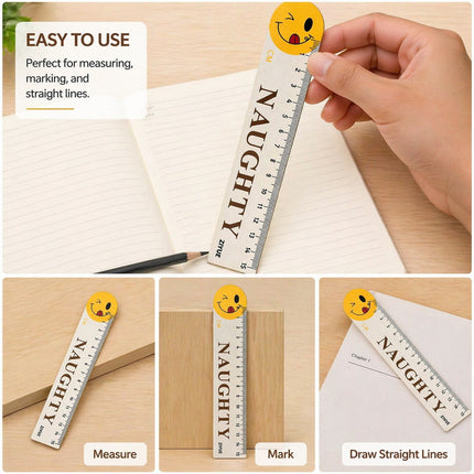 Small ruler with 'NAUGHTY' text and smiley face, held by a hand over a notebook.