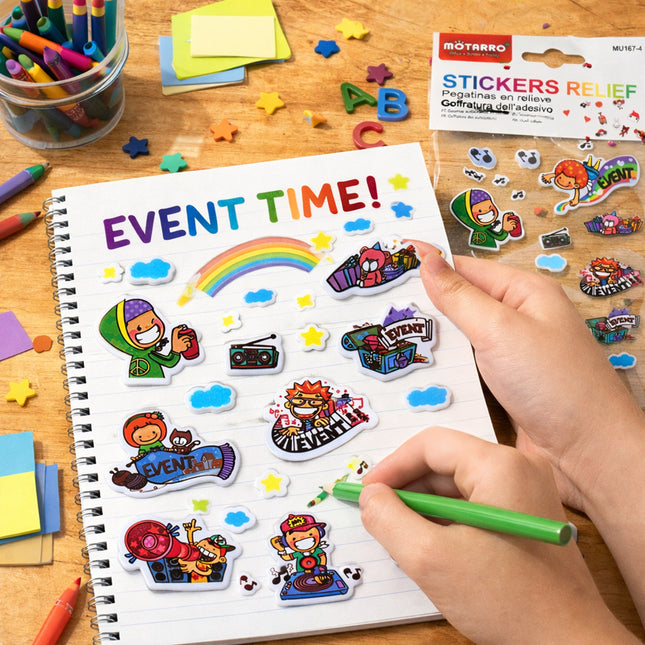 Children's notebook with stickers and a hand holding a green pen on a wooden table.