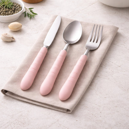 Set of pink cutlery including knife, spoon, and fork on a beige napkin with a light background.