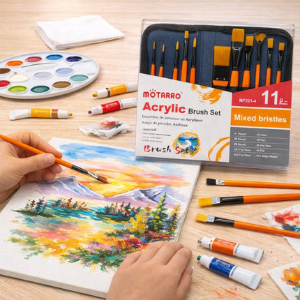 Acrylic brush set with painting materials on a wooden surface