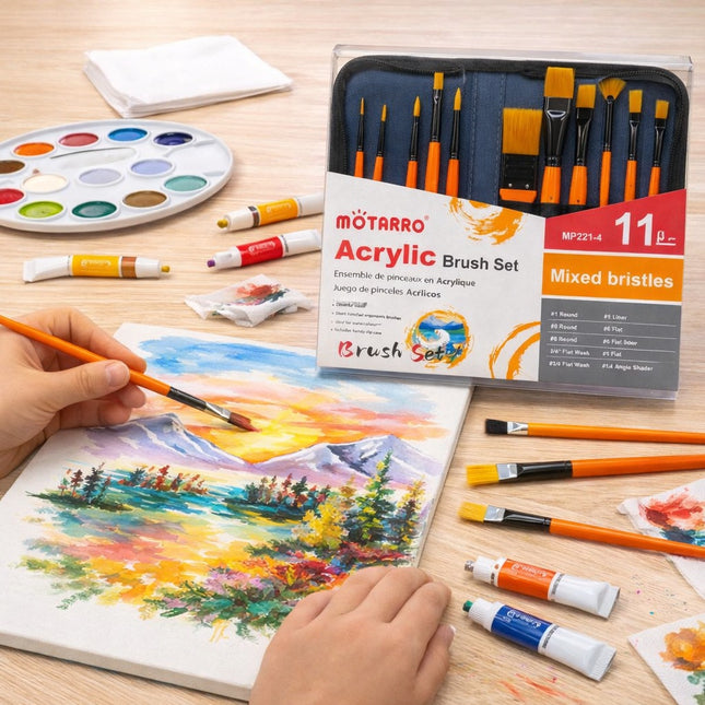 Acrylic brush set with painting materials on a wooden surface