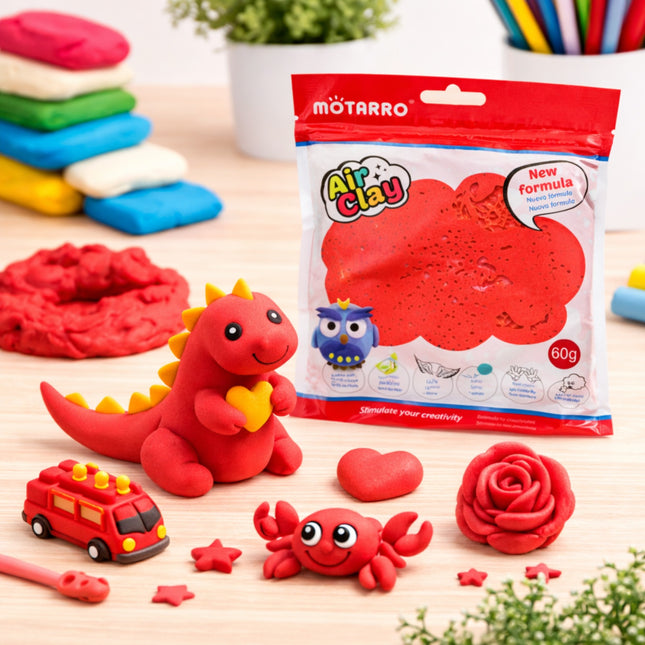 Red Air Clay package with clay models on a wooden surface