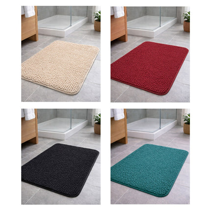 Four bath mats in beige, red, black, and teal on a bathroom floor.