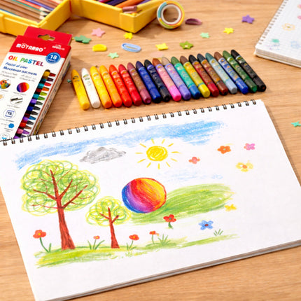 Coloring book with a child's drawing of a landscape, pastels, and a coloring book on a wooden table.