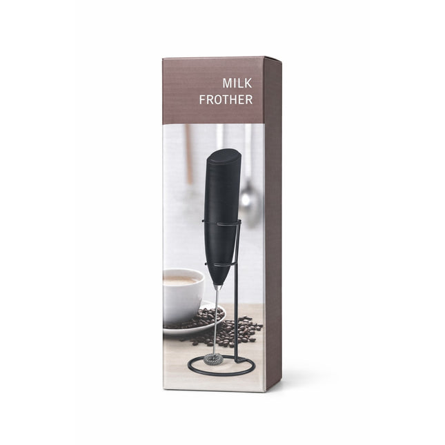 Milk frother in packaging with a cup and coffee beans on a white background