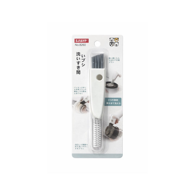 Cleaning brush with packaging on a white background