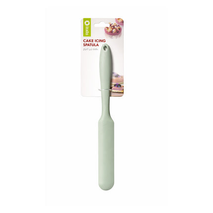 Green cake icing spatula with packaging on a white background