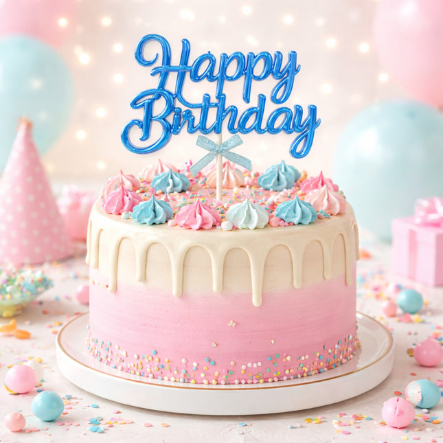Birthday cake with pink and blue decorations and 'Happy Birthday' topper.