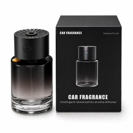 A car fragrance diffuser bottle with a black-to-clear gradient glass body and a black top cap, shown next to its black retail box on a white background.