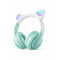 Mint green headphones with cat ear design on a white background