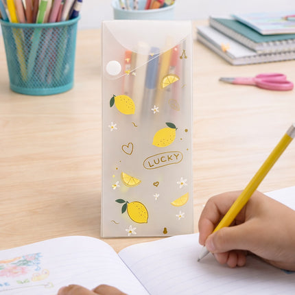Pencil case with lemon design on a desk with stationery items
