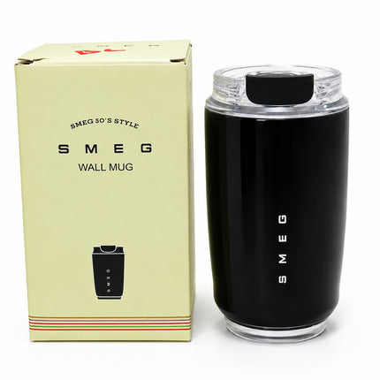 SMEG wall mug in black with a clear lid, shown next to its cream-colored packaging box on a white background.