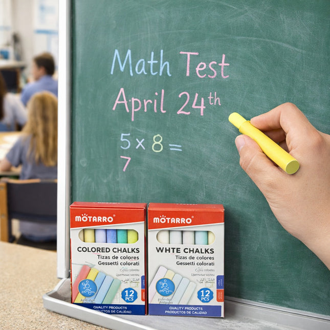 Mоторро colored and white chalks with a hand writing on a chalkboard in an educational setting.