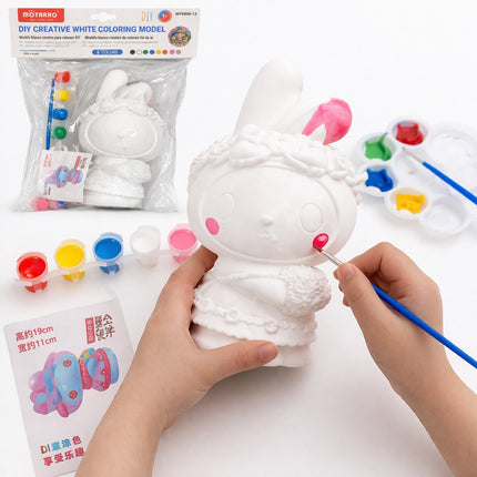 Person painting a white coloring model with paint supplies on a white background