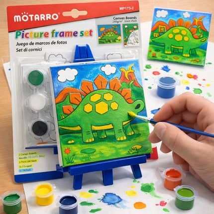 Children's art set with painting materials and a dinosaur picture on a table.