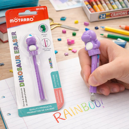 Purple dinosaur-shaped eraser pen with packaging and a hand holding it on a notebook with 'RAINBOO!' written.