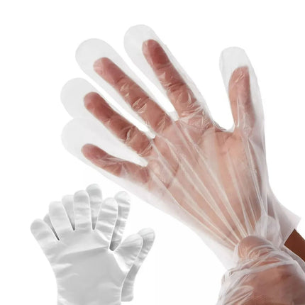 Clear plastic gloves on a white background