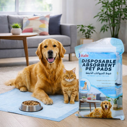 Dog and cat on a disposable absorbent pet pad with a package of italo pads in a living room setting.