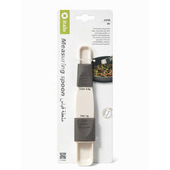 Measuring spoon with packaging on a white background