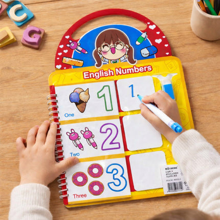 Child using an educational English numbers learning board on a wooden table.