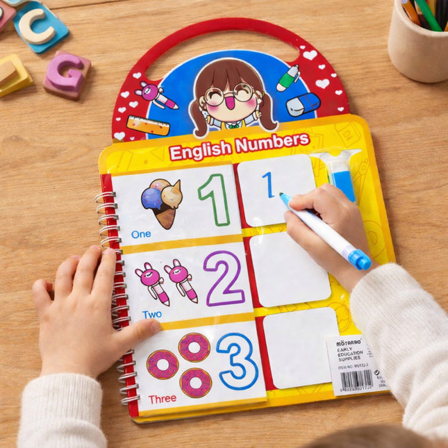 Child using an educational English numbers learning board on a wooden table.