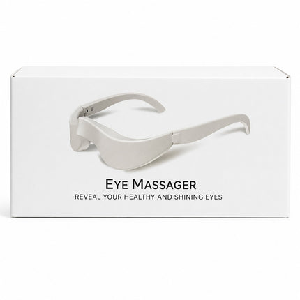 White product packaging box for an eye massager, featuring a printed graphic of the light gray eye massager and the text 'EYE MASSAGER' and 'REVEAL YOUR HEALTHY AND SHINING EYES'.