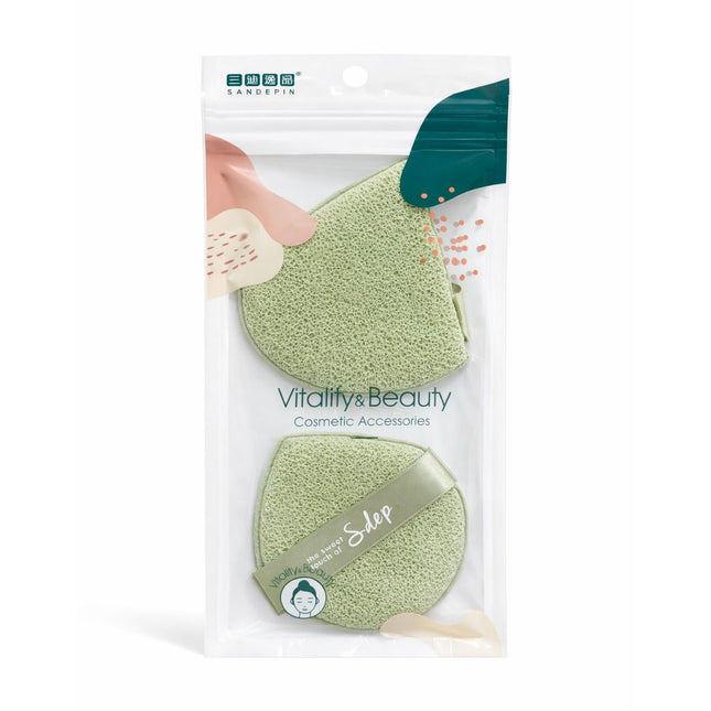 Packaged green cosmetic sponges with 'Vitality & Beauty' branding on a white background.