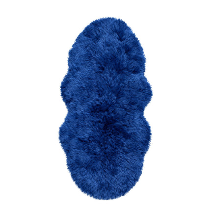 Blue fluffy rug on a white background