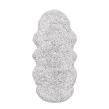 Fluffy gray rug on a white background