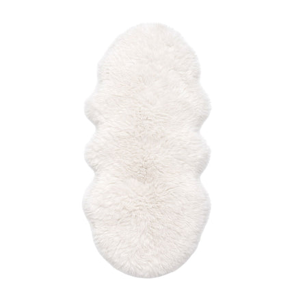 White fluffy slippers on a white background
