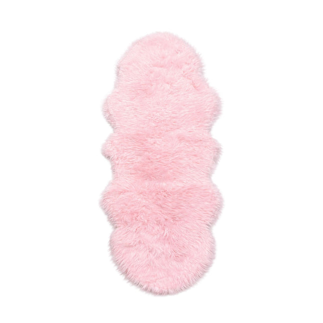 Pink fluffy rug on a white background