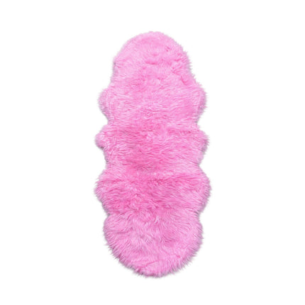 Pink fluffy rug on a white background
