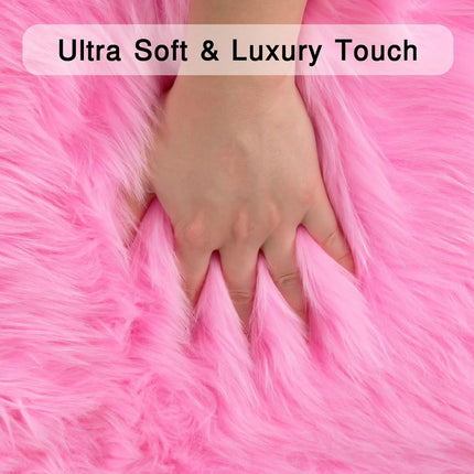 Hand touching pink fluffy material with text 'Ultra Soft & Luxury Touch' above it.