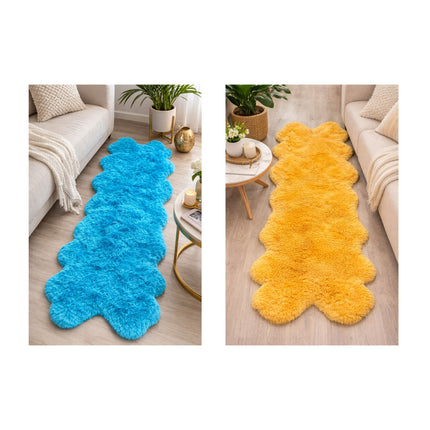 Two fluffy rugs, one blue and one yellow, on a wooden floor with a neutral-colored sofa and decor in the background.