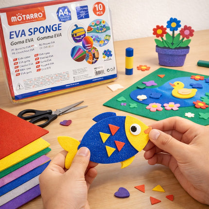 Child holding a fish-shaped EVA sponge craft with packaging and materials on a table