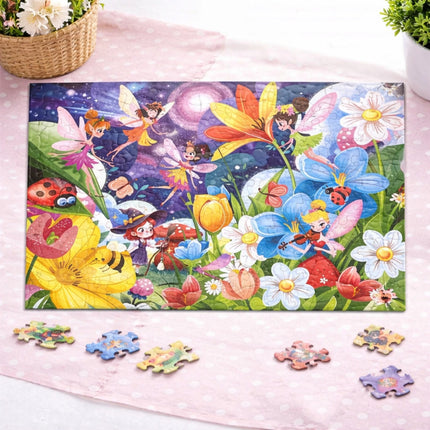 Children's fairy-themed puzzle with missing pieces on a pink surface