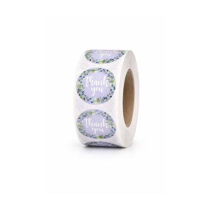 Roll of round stickers with 'Thank you' text on a white background