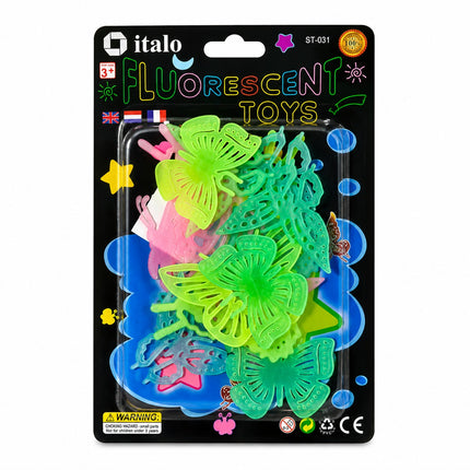 A retail package of Italo brand fluorescent plastic toys, featuring butterfly-shaped items in bright green and pink, along with other colorful plastic pieces, all sealed in a clear blister pack on a black backing card.