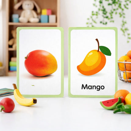Fruit-themed educational cards with a mango illustration on a white surface.