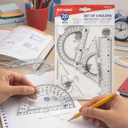 Set of 4 rulers with packaging on a desk with stationery items