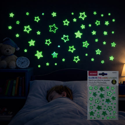 Child sleeping with glow-in-the-dark star stickers on the wall and a package of stickers next to them.