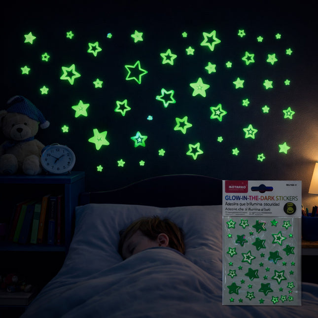 Child sleeping with glow-in-the-dark star stickers on the wall and a package of stickers next to them.