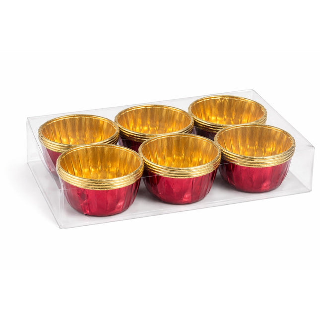 Set of red and gold foil cups on a white background