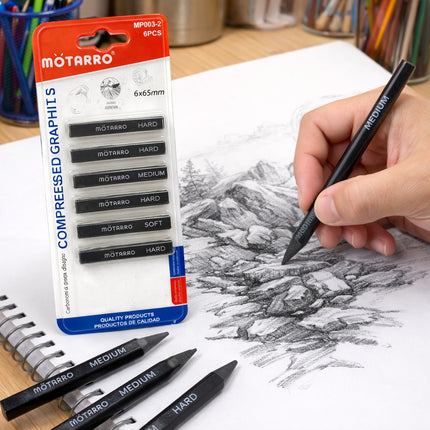 Motarro compressed graphit set with pencils and packaging on a drawing surface