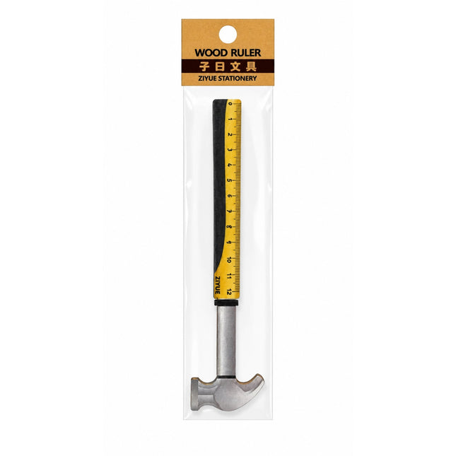Wood ruler with hammer head in packaging on a white background