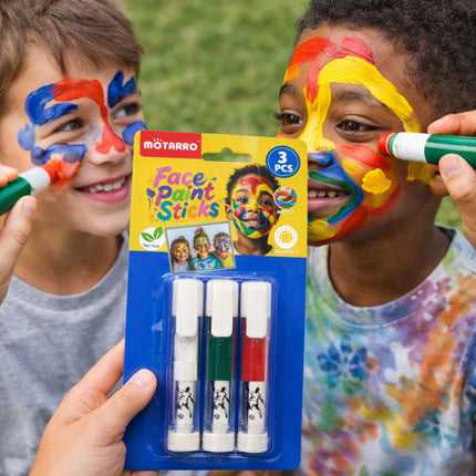 Two children with colorful face paint holding a Mötarro face paint sticks kit.