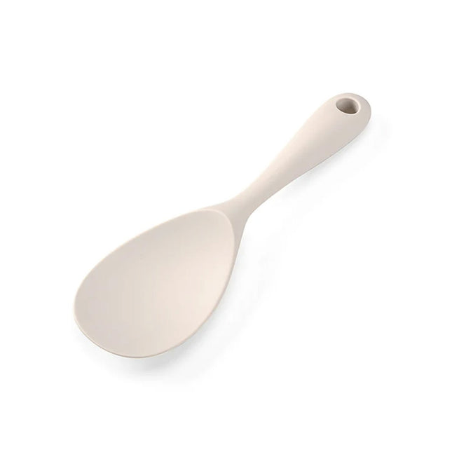 Beige ceramic spoon on a white background