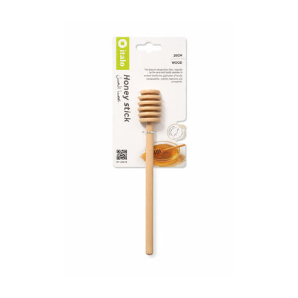 Wooden honey stick with packaging on a white background