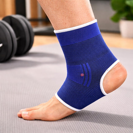 Blue ankle support brace on a person's foot with gym equipment in the background
