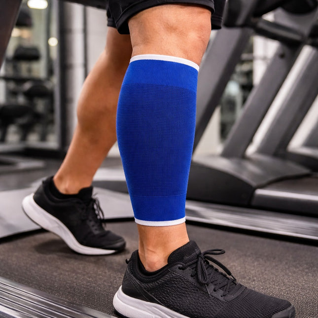 Person wearing a blue compression sleeve on a treadmill in a gym setting